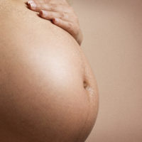 belly of pregnant woman for NYC massage